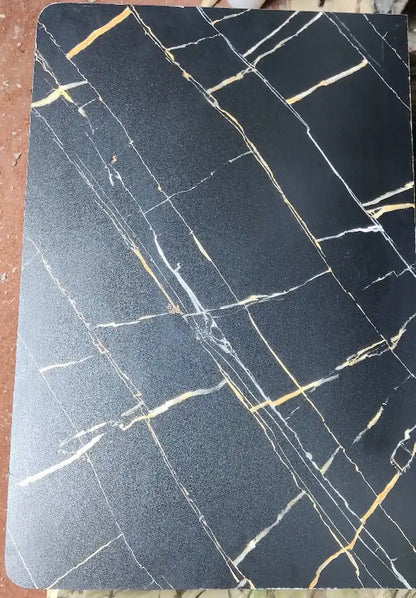 Marble-patterned black and gold table designs in pakistan